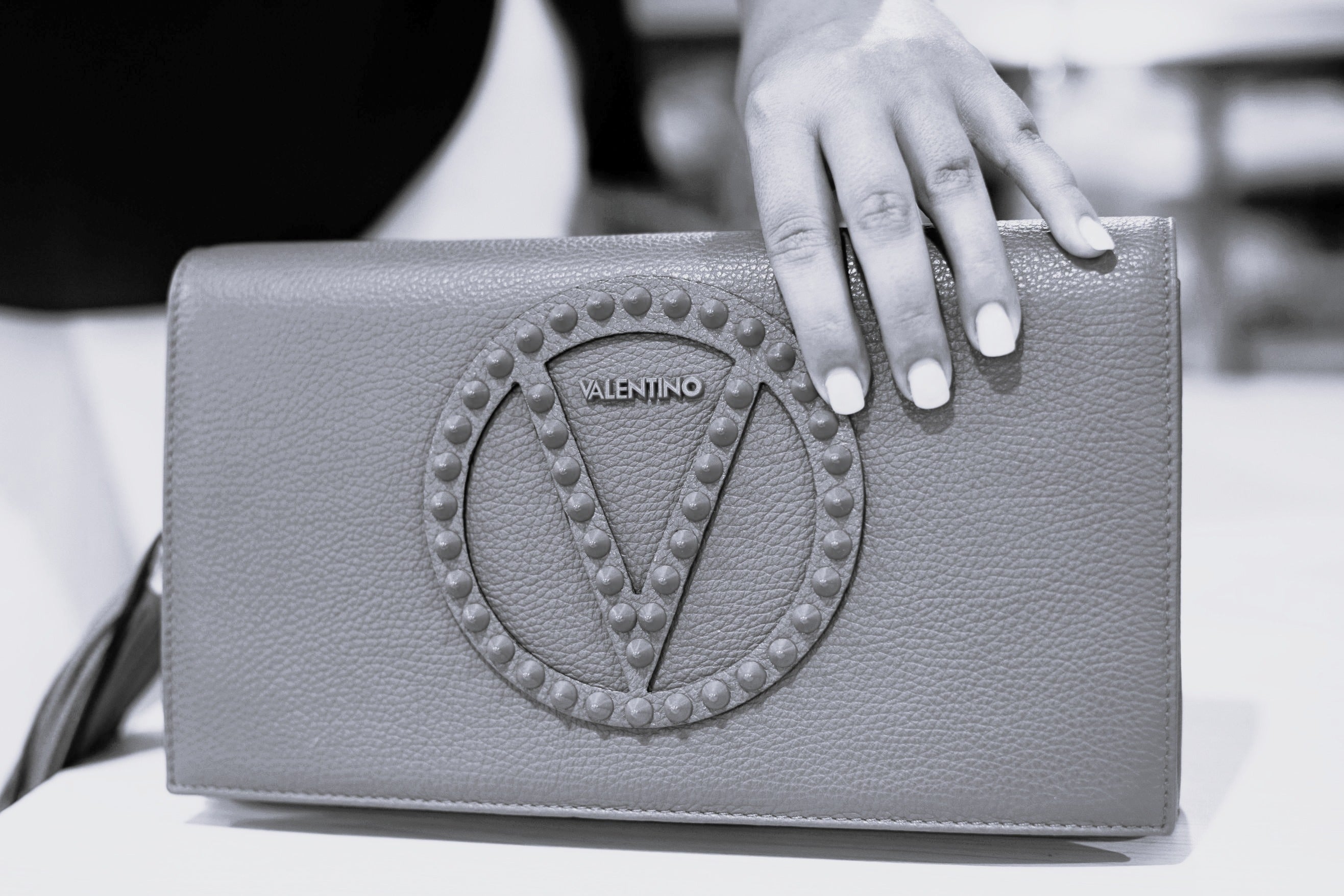Woman hand holding a Valentino Bag