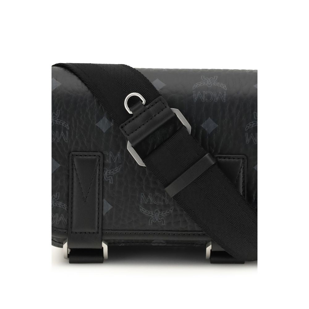 Close-up of MCM logo motif on black fabric shoulder bag