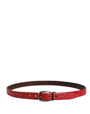 Red belt with a silver buckle on a white background