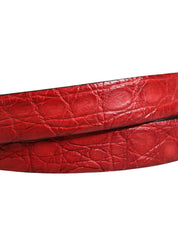 Red leather belt with a textured pattern on a white background