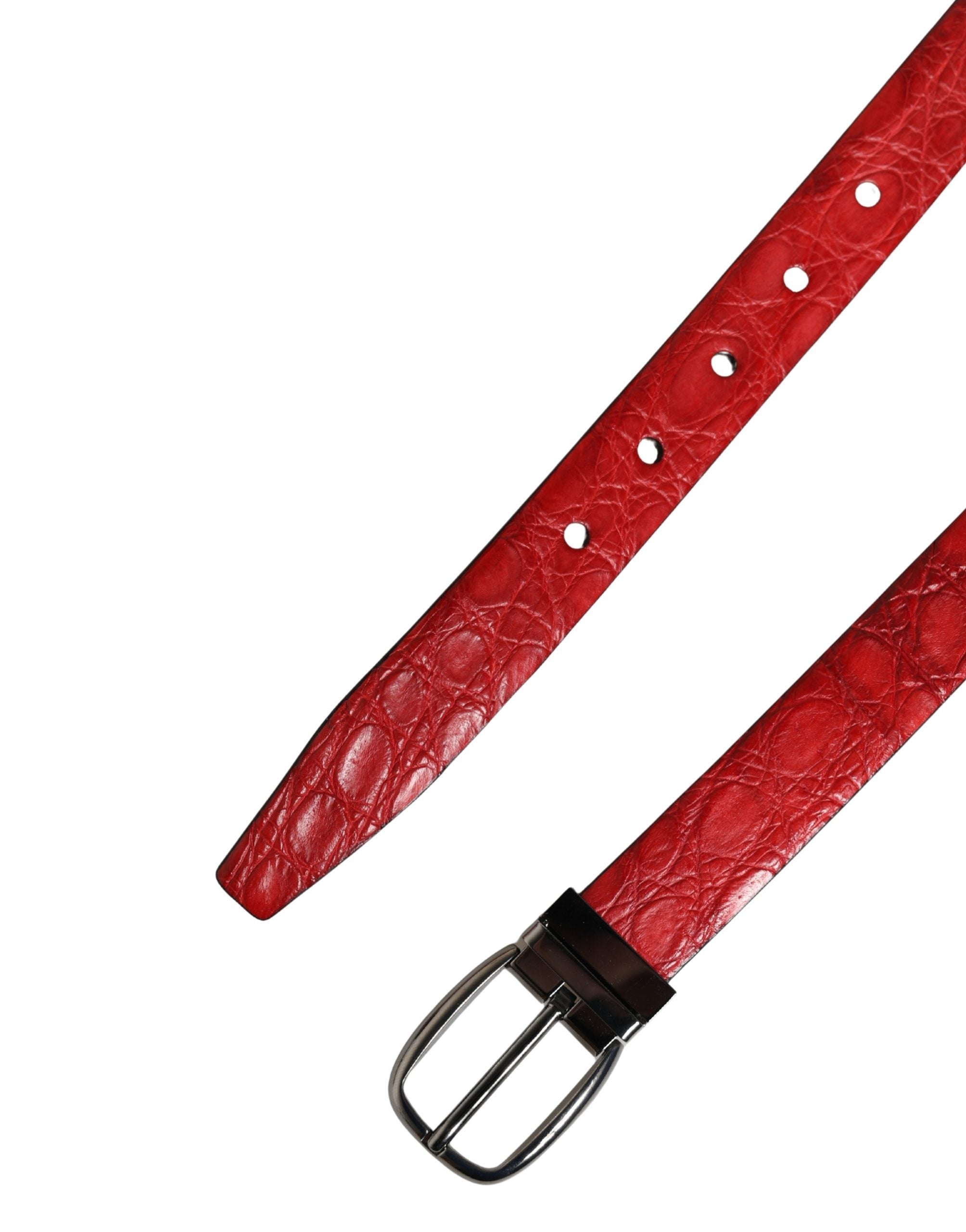 Red leather belt with a silver buckle on a white background