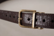 Brun läderrem i kalvskinn med vintage-logo och metallspänne