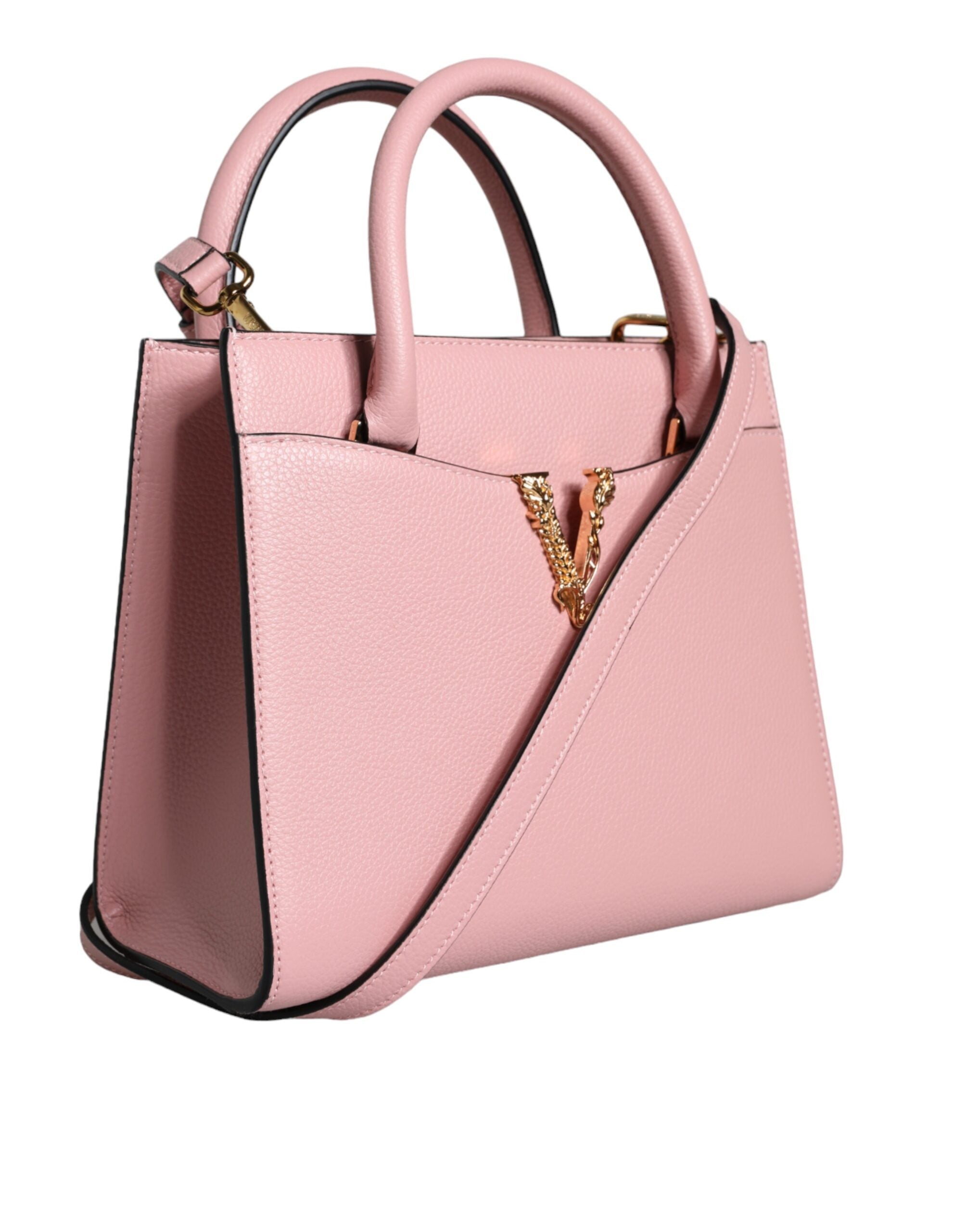 Liten rosa axelväska i läder med övre handtag och strukturerat kalvskinn.