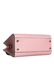 Liten rosa axelväska i läder med övre handtag och strukturerat kalvskinn.