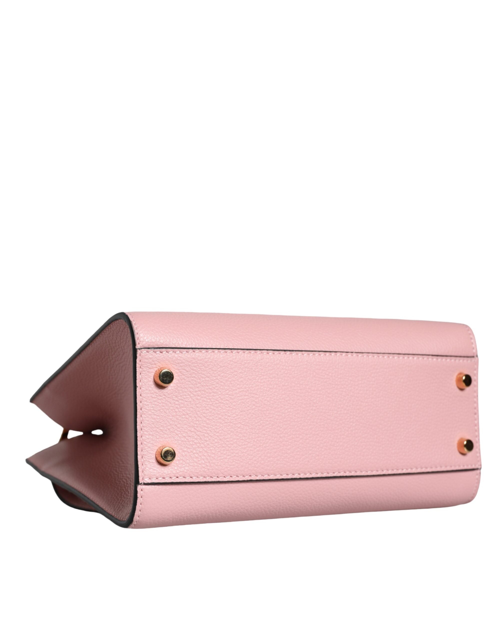 Liten rosa axelväska i läder med övre handtag och strukturerat kalvskinn.