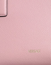 Liten rosa axelväska i läder med övre handtag och strukturerat kalvskinn.