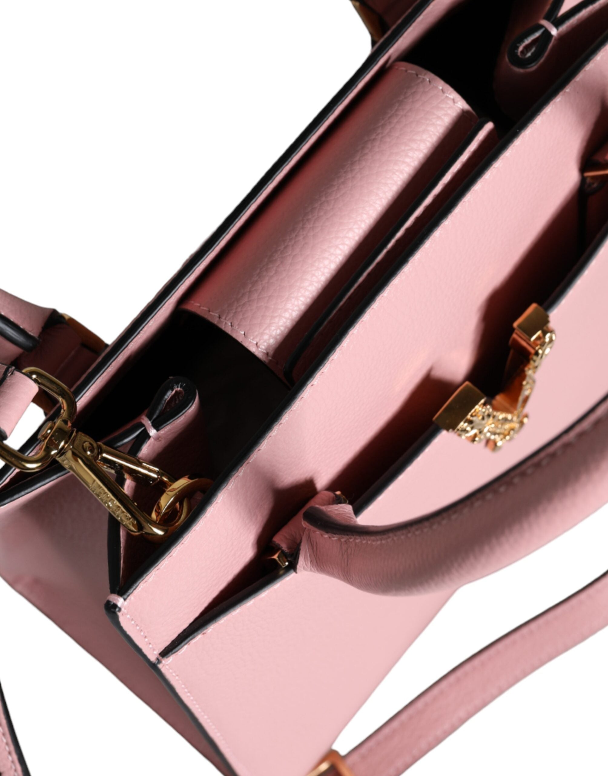 Liten rosa axelväska i läder med övre handtag och strukturerat kalvskinn.