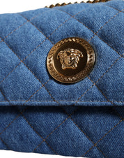 Blå quiltad läderaxelväska i denim