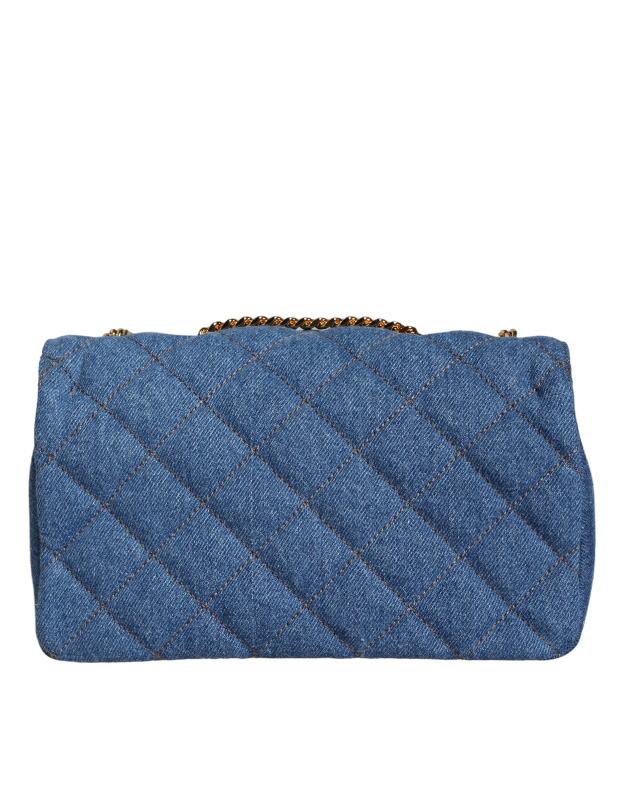 Blå quiltad läderaxelväska i denim