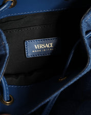 Blå quiltad läderaxelväska i denim