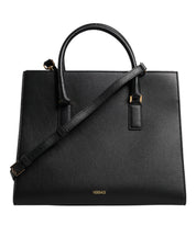 Stor svart lädertrolleyväska/axelväska/väska som kan bäras över axeln