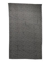 Svart prickig polyestersjal med omlottmönster