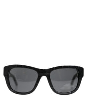 Solglasögon med svart läderram och tonade linser, modell DG4177.