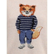 Krämfärgad tröja i merinoull med klädd rävintarsia