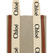 Beige linneaxelväska med läderdetaljer