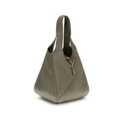 Grön axelväska i kalvskinn med lappmönster