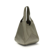 Grön axelväska i kalvskinn med lappmönster