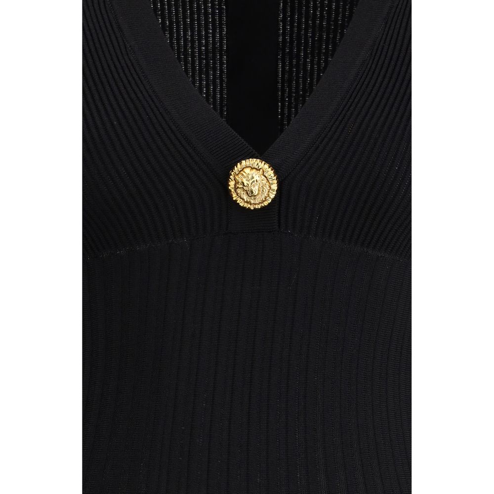 Svart miniklänning i viskos med knapp i lejonhuvud