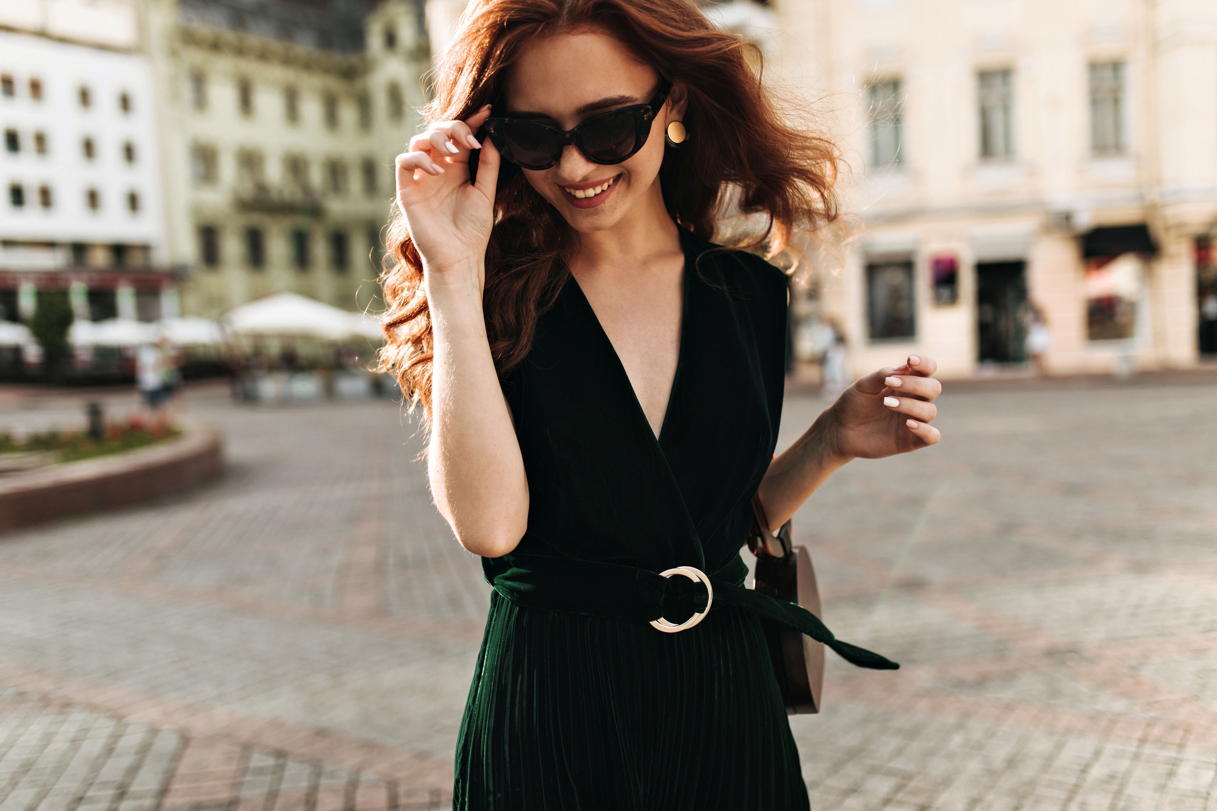 charming-woman-velvet-outfit-sunglasses-smiling-outside1.jpg